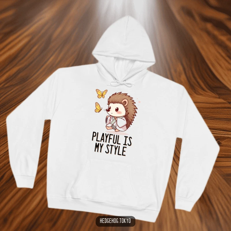 Funny Hedgehog Hoodie: A playful hedgehog in a loose kimono joyfully chases a butterfly, offering cozy comfort and animated humor.