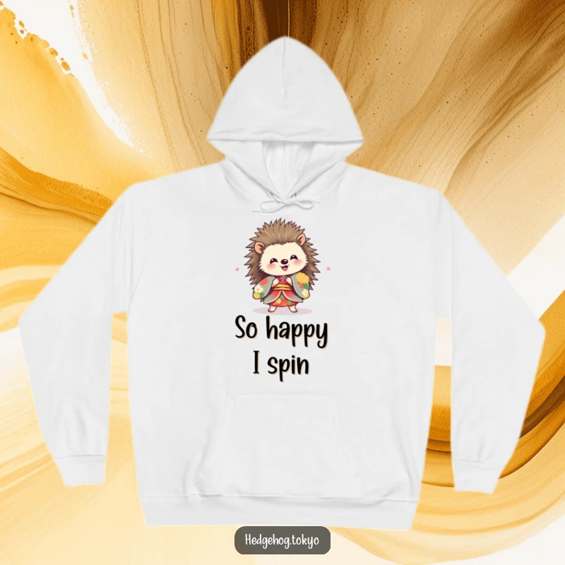 Funny hedgehog wearing a vibrant kimono, spinning with delight, depicted on a warm and cozy hoodie.