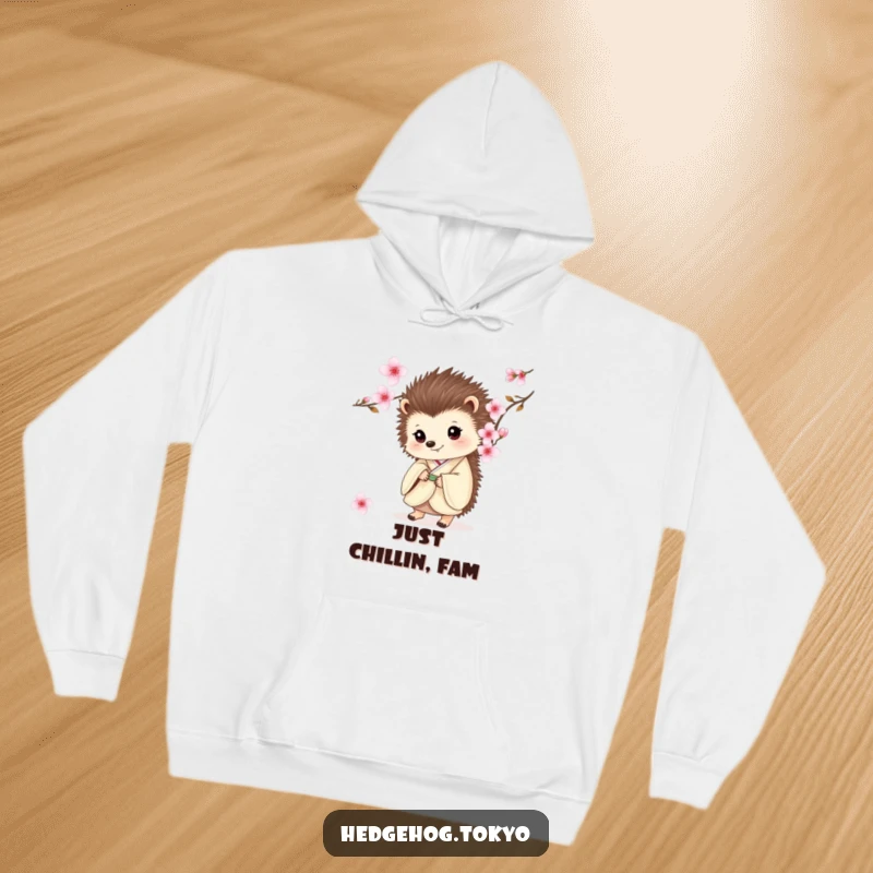Funny hoodie depicting a delightful hedgehog in a traditional kimono, peeking shyly from behind a beautiful cherry blossom.