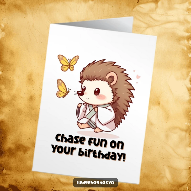 Funny Free Printable Birthday Card: A happy hedgehog in a loose kimono playfully chasing a butterfly with bright eyes.