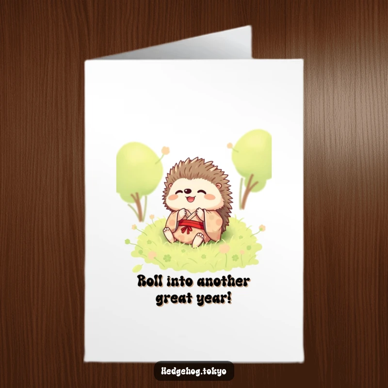 Funny free printable birthday card showing a happy hedgehog in a kimono rolling in soft moss.