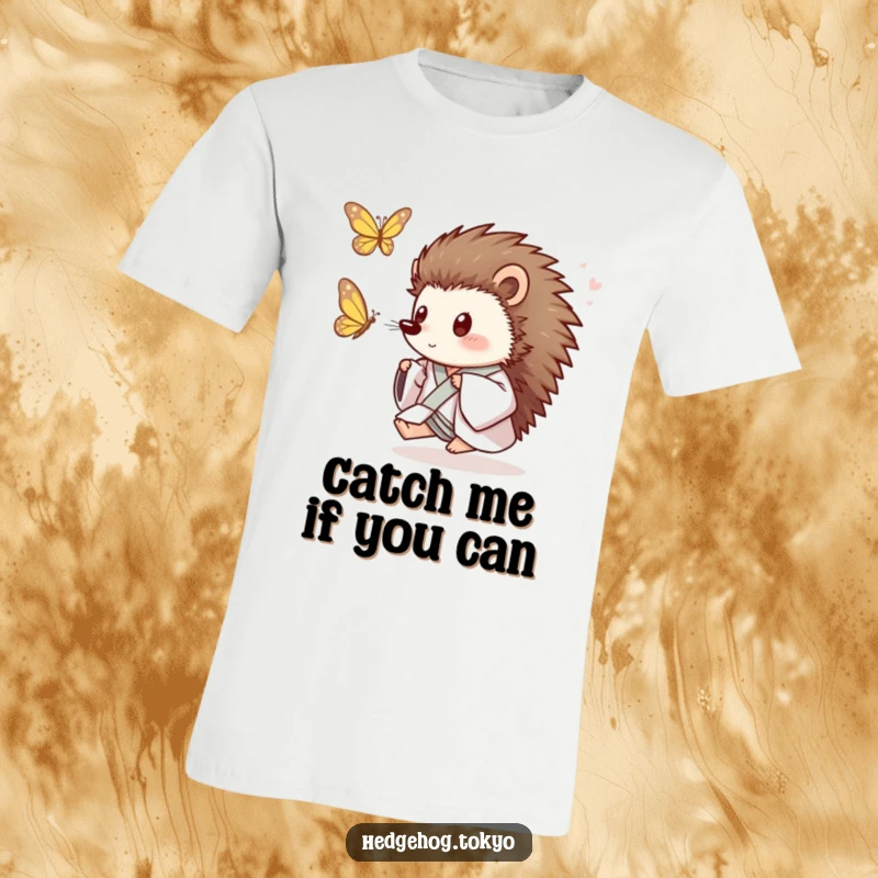 Funny Hedgehog T-Shirt: A playful hedgehog in a loose kimono enthusiastically chases a fluttering butterfly, showcasing pure joy and humor.