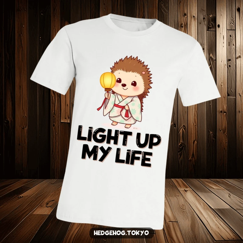 Funny t-shirt featuring a hedgehog in a summer kimono, holding a paper lantern that emits a soft, inviting glow.